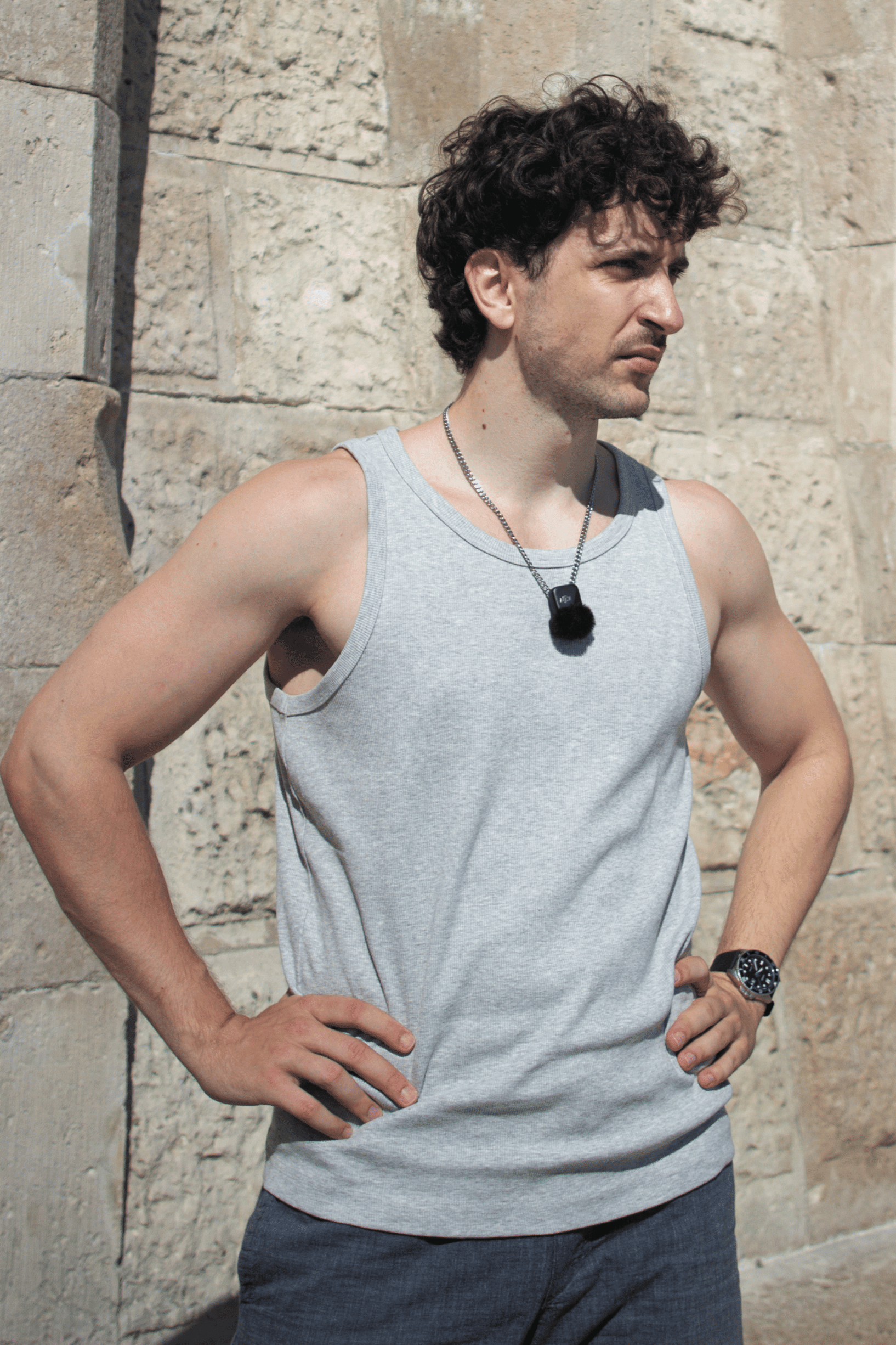 Nick Ambrus, digital detox guide, standing outdoors against a stone wall